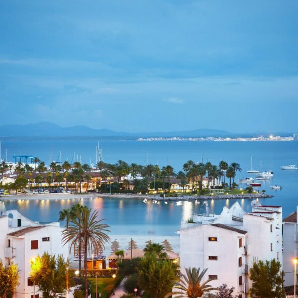 Port de Alcudia cityscape at sunrise, Mallorca, Spain.